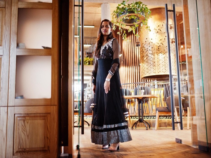 pretty-indian-girl-black-saree-dress-posed-restaurant_627829-2050